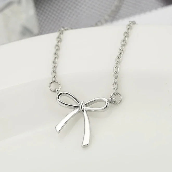 Collier en or pour femmes, collier à nœud plaqué or et argent, pendentif à nœud mignon, ras du cou, chaîne, bijoux cadeau pour femmes L’AURA